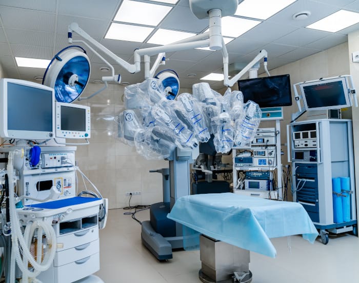 A clean and prepped operating room showing advanced surgical equipment